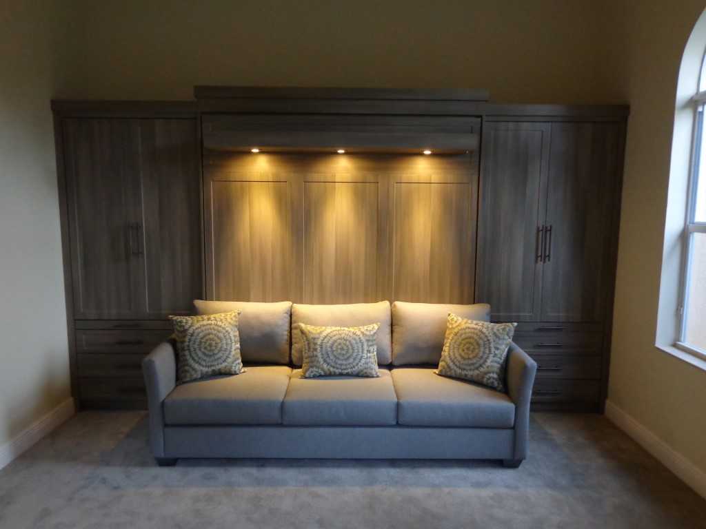 elevated murphy bed over plain sofa